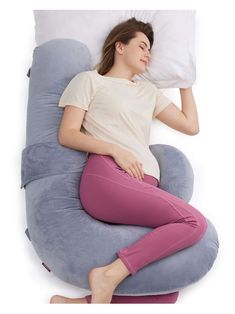 a woman laying down on an inflatable pillow