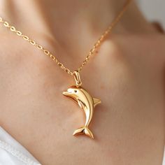 14k Gold Dolphin Fish Pendant, Gold Dolphin Fish Pendant, Dainty Gold Fish Pendant, Animal Fish Pendant, Designer Fish Pendant 🌺Item Details🌺 Item Name : Dolphin Fish ( Only Pendant ) Metal : 925 Silver Size : 30MM Eye Stone : Black Spenel                                        🌊 *About Us: Natural World Jewelry* 🐚 At Natural World Jewelry, we're passionate about bringing the serene beauty of the ocean to your everyday life. Our artisanal jewelry pieces are lovingly handcrafted using a diver Luxury Yellow Gold Fish-shaped Necklace, Silver Fish Jewellery, Fish Locket In Gold, Fish Earrings Gold, Fish Pendant Gold, Gold Fish Necklace, Emerald Stone Rings, Dolphin Fish, Dolphin Jewelry