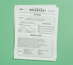 a breakfast menu sitting on top of a green table