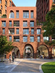 an artist's rendering of a building with arches and people walking in the courtyard