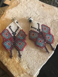 Sweet artisan made beaded butterfly earrings. The earrings have a 2-1/2 inch drop and are 1-3/8 inch wide. Bohemian Butterfly Shaped Beaded Jewelry, Bohemian Butterfly Beaded Jewelry, Handmade Multicolor Butterfly Earrings, Unique Handmade Butterfly Earrings, Handmade Butterfly Beaded Earrings For Gift, Beaded Butterfly Earrings, Earrings Native American, Beaded Butterfly, Native American Style