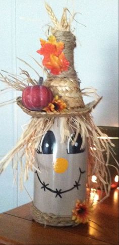 a scarecrow made out of hay and pumpkins