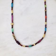 NKL Ferris Wheel Necklace in Gold & Ruby Spiritual Multi-stone Beaded Necklaces As Gifts, Spiritual Multi-stone Beaded Necklace For Gift, Multicolor Spiritual Jewelry With Tiny Beads, Green Multi-stone Beaded Necklace For Gift, Smokey Topaz, Roman Glass, Ruby Sapphire, Silver Accents, 22k Gold