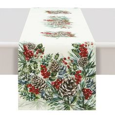 a table cloth with pine cones and berries on it