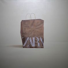 a brown paper bag with the word vary printed on it, sitting against a white background