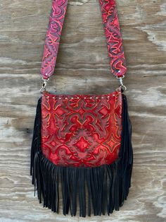 Made of extremely soft genuine leather Leather fringe along the bottom and sides Nail head trim along the top 1 pocket inside - 1 pocket outside Zipper closure for the entire purse 2″ wide leather strap - approx 27″ strap drop Extremely light weight Purse measures approx: 12″ L x 10″ H - laying flat Last photo is for size reference only Red Faux Leather Bags With Adjustable Strap, Red Faux Leather Bag With Adjustable Strap, Red Leather Crossbody Shoulder Bag, Red Shoulder Bag With Leather Backing For Everyday Use, Red Leather Shoulder Bag For Everyday Use, Red Textured Leather Crossbody Shoulder Bag, Red Leather Shoulder Bag With Leather Backing, Red Hand Tooled Shoulder Bag For Daily Use, Red Soft Leather Shoulder Bag