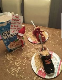 two plates with food on them sitting on a table next to a bag of rice