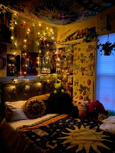 a bedroom decorated for christmas with lights strung from the ceiling and decorations on the wall