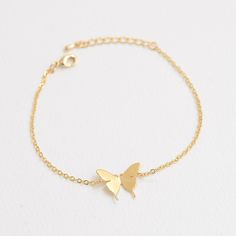 "These personalized butterfly bracelets will be perfect thank you gifts for your wedding, anniversaries, and birthdays. You can also gift these to your best friends, bridesmaids and sorority sisters! Great minimal bracelets for layering or for easy, everyday wear. D E T A I L S - Delicate Initial Butterfly charm - Butterfly Size: 13mm x 17 mm - Hand-Stamped Initial of your choice - We can stamp Uppercase letters, numbers,♡ (heart) - Available in Gold, Rhodium, or Rose gold Plated - This listing Silver Bracelet With Butterfly Clasp For Gift, Adjustable Dainty Butterfly Bracelet, Dainty Silver Butterfly Bracelets, Silver Dainty Butterfly Bracelets, Silver Butterfly Bracelets For Gifts, Butterfly Shaped Silver Bracelet Gift, Silver Butterfly Bracelet For Gift, Personalized Adjustable Butterfly Jewelry, Butterfly Charm Bracelet Jewelry Gift