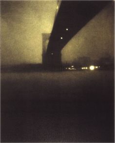 the underside of a bridge at night with fog and light from cars passing under it