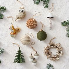 christmas ornaments are arranged on the snow