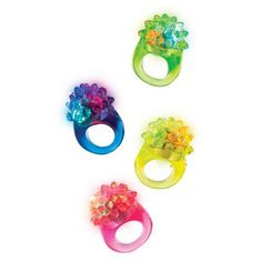 three different colored rings with flowers on each one and an attached ring in the middle