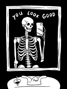 a skeleton holding a computer sticker with the words you look good written on it