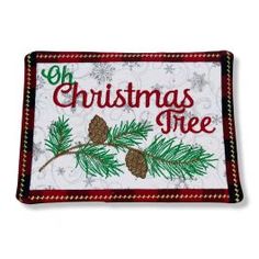 a christmas tree patch with pine cones on it