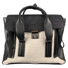 3.1 PHILLIP LIM "Pashli Medium Satchel" handbag comes in a black & white textured embossed leather featuring double top handles, contrasted against zipper gussets that un zip into a fan shape, detachable cross body strap, and a push lock closure. Includes dust bag. New Without Tags. Measurements: Length: 12.5 inches Width: 6 inches Height: 9 inches Drop: 22 inches Reference: 113618 Category: Handbag & Leather Goods More Details Brand: 3.1 PHILLIP LIM Color: Black Color 2: White Pattern: Textured Phillip Lim Bag, Black Leather Top, Black Leather Satchel, Day Bag, Satchel Handbags, Coach Swagger Bag, Phillip Lim, Green Leather, Leather Satchel