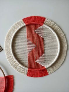 a red and white plate sitting on top of a table next to a knife and fork