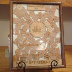 there is a framed cork board with the words happy retirement written on it and lots of small hearts