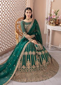 Net Green Lehenga Choli Pakistani Wedding Dresses is the magic of linear design with engaging embellishments on a forest green which makes lehenga choli an eye-catching outfit. The timeless silhouette is crafted on Korean silk, with floral and lined motifs. Lavishly adorned lehnga is flawlessly hand-worked passing it a sublime look. The elaborately detailed border and sequin spray on the organza dupatta makes the costume ideal for any festive event. Green Lehenga Choli: Pakistani Wedding Dress g Green Bridal Lehenga, Lehenga Choli For Wedding, Blue Lehenga Choli, Choli For Wedding, Pakistani Bridal Lehenga, Desi Clothing, Green Lehenga Choli, Pakistani Bridal Dress, Cutwork Blouse