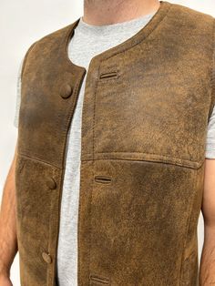 Perfect for three seasons, with the choice to layer on cooler days. Our sheepskin vest are durable, stylish and 100% natural allowing for your body to regulate warm in a productive way. Do you hate how body heat feels from polyester or synthetic fabrics? Then natural sheepskin and wool is the right choice for you. Our rancher vest is made from 100% leather and lined with 100% black mutton sheepskin. Our first model is wearing a size Large, is 6’ 5” and 175 pounds Our second model is wearing a si