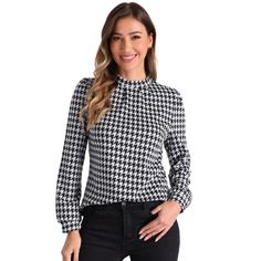 The classic houndstooth print adds a timeless and sophisticated atmosphere, making it a standout statement piece for any occasion. The long sleeves provide excellent coverage and warmth, making it perfect for cooler days while maintaining a sleek and elegant silhouette. This versatile blouse is perfect for pairing with tailored pants or skirts, making it an essential choice for those seeking a chic and sophisticated style that effortlessly transitions from day to night. Mock Neck Blouse, Mock Neck Long Sleeve, Black Houndstooth, Puff Long Sleeves, Women's Blouses, Elegant Blouses, Plaid Blouse, Work Tops, Blouse Black