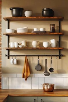 the shelves are filled with pots, pans and cooking utensils on them