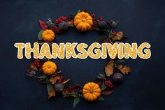 the word thanksgiving written in letters surrounded by pumpkins and autumn leaves on a dark background