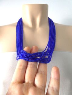 This stunning cobalt blue necklace is bold and powerful. The blue color is just beautiful and reflects the light softly.  It has 12 strands and you can choose size and clasp color (silver or gold) and your preferred length at checkout. Matching bracelet available here: https://www.etsy.com/listing/165759619/sapphire-braceletroyal-blue?ref=listing-shop-header-0Size shown is 24". Please read specifications on SIZES below:❤ SIZESThis item comes in several sizes, kindly choose at checkout. The easie Blue Multi-strand Elegant Beads, Elegant Multi-strand Blue Beads, Elegant Blue Multi-strand Beads, Blue Beaded Necklace With Tiny Beads For Party, Blue Beaded Necklaces With Tiny Beads For Party, Blue Beaded Necklace For Party, Blue Party Beaded Necklace With Tiny Beads, Blue Tiny Beads For Party, Party Jewelry With Tiny Blue Beads