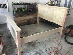 the bed frame is made up and ready to be put into place in the garage