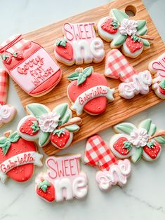 decorated cookies in the shape of numbers and strawberrys