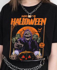 Stay spooky every day with our 'Everyday is Halloween' Unisex Tee! Featuring a zombie design, this t-shirt is perfect for horror fans and Halloween enthusiasts. Made with high-quality material, it's comfortable for everyday wear. Embrace your love for all things spooky with this unique and stylish tee. . Everyday is Halloween. 100% combed ringspun cotton· Light fabric· Premium fit· Runs bigger than usual· Original design Care Instructions: Machine wash cold. Do not bleach. Tumble dry low. Gothic Skull Print T-shirt For Halloween, Gothic Halloween T-shirt With Letter Print, Black Horror T-shirt With Skull Print, Horror Black T-shirt With Skull Print, Halloween Horror Skull Print T-shirt, Spooky Halloween T-shirt For Streetwear, Spooky Halloween Graphic Print T-shirt, Spooky Halloween Graphic T-shirt, Halloween Horror T-shirt With Screen Print