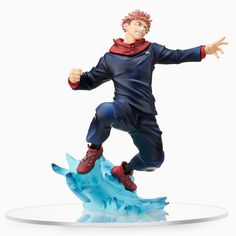 a figurine is posed on top of an ice floet with his arms outstretched