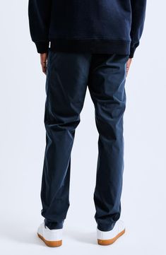 Tapered legs define pants made from Solotex polyester and cotton that are a modern, performance-oriented take on classic chinos. 31 1/2" inseam; 7" leg opening; 11" front rise Zip fly with button closure Front slant pockets; back welt pockets 66% cotton, 34% Solotex polyester Solotex polyester is spun with a spring-like, helical structure that provides a soft, stretchy texture with gentle cushioning and high shape retention Machine wash, tumble dry Imported Chino Cotton Twill Bottoms With Welt Pockets, Chino Cotton Twill Bottoms For Business Casual, Chino Cotton Twill Dress Pants With Pockets, Straight Hem Chino Cotton Twill Dress Pants With Pockets, Relaxed Fit Chino Cotton Twill Chinos, Tapered Leg Chino Twill Work Pants With Side Pockets, Relaxed Fit Chinos In Chino Cotton Twill, Relaxed Fit Chinos In Cotton Twill, Tapered Chino Cotton Twill Pants With Straight Hem