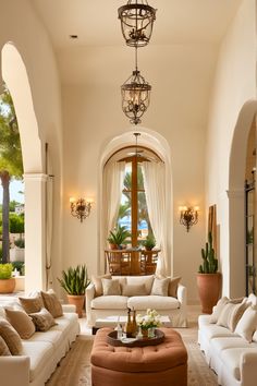 a living room filled with lots of white furniture