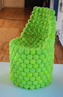 a green chair made out of tennis balls