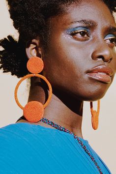 Nothing better than a classic round earring! This design is a monochrome fantasy of orange, ready to get your extravaganza ready! Materials used: 10% cotton 90 polyester glass beads cotton embroidery Product care: Keep it stored in a dust-free container, clean with a regular wet-wipe if necessary. Earring Photoshoot, Embroidery Product, Unique Earring, Round Earring, Editorial Hair, Earrings Aesthetic, Style Muse, Earring Designs, Cotton Embroidery