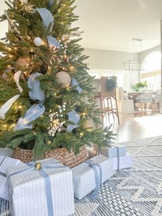 a decorated christmas tree with presents under it