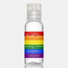 a bottle of water with a rainbow label on the front and bottom, that says thank you