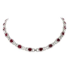 This beautifully elegant necklace in platinum 950 features 22 oval-cut rubies from Burma. They are of pure and intense red colour and have a total weight of approximately 22.00 carats. Each ruby is surrounded by brilliant-cut diamonds of G/H colour and vs clarity, total weight of the 660 diamonds is approximately 5.00 carats. The elegant links between the rubies are set with 22 sleek baguette-shaped diamonds of G/H colour and vs clarity, total weight approximately 2.50 carats. Box clasp in platinum 950. Assay mark: PLAT Length: 42.0 cm / 16.5 in Weight: 42.45 gr. Most Expensive Pearl, Expensive Necklaces, Ruby Necklace Designs, Night Luxe, Ruby Diamond Necklace, Gold Ruby Necklace, Goth Wardrobe, Cloth Collection, Platinum Necklace