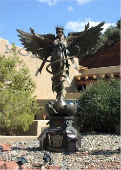 a statue is shown in front of a building