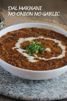 a white bowl filled with soup on top of a table