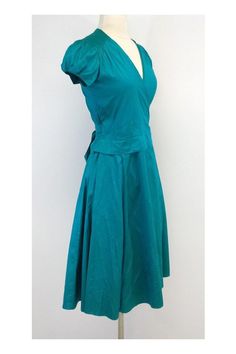 Size X-Small Deep Teal Wrap Dress Body 100% Silk Made in the USA Cap sleeves with elastic detail V neck Hits below the knee Wrap and tie waist for adjustable fit Underarm to underarm 18" Total length 42.5" Usa Cap, Silk Wrap Dress, Knee Wraps, Silk Wrap Dresses, Body Dress, Silk Wrap, Deep Teal, The Knee, Cap Sleeves