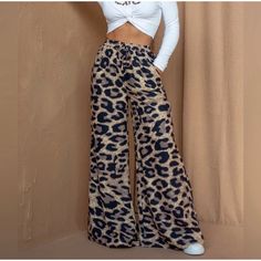 By Egreis Nwot Cheetah Flare Pants Brand New Without Tags. 13 Inches At Waistband, 13 Inch Rise, 32 Inch Inseam. Pants Color, Black Tan, Flare Pants, Black And Tan, Pant Jumpsuit, Wide Leg, Pants For Women, Brand New, Tags