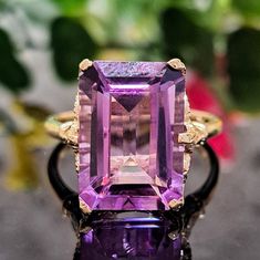 7.10 Carat Natural Amethyst & Diamonds 14k Solid Gold Ring Ring Material: 14k Solid Gold Approximate Weight: 4.9 Grams Gemstone: Natural Aquamarine Gemstone Color: Purple Gemstone Shape: Emerald Cut Gemstone Dimensions: 14.00x10.00 mm Approximate Carat Weight: 7.00 Carat Gemstone Quantity: 1 Diamonds: Natural Round Shaped Diamonds Quantity: 4 Diamonds Total Carat Weight: 0.10 Carat Approximate Total Carat Weight: 7.10 Carat Approximate Height of the Crown of the Ring: 10mm Ring Quantity: One Ring Condition: New Made in the USA Delivered in an elegant gift box 💜 Please do not hesitate to ask any questions and we will be happy to assist You 💜 Art Deco Amethyst Ring In Yellow Gold, Yellow Gold Amethyst Ring In Art Deco Style, Amethyst Gemstones In Yellow Gold With Prong Setting, Amethyst Gemstones In Prong Setting - Yellow Gold, Formal 14k Gold Amethyst Ring With Center Stone, Art Deco Yellow Gold Amethyst Ring, Formal Purple Topaz Gemstone Ring, 14k Gold Emerald-cut Amethyst Ring With Center Stone, Emerald Cut Amethyst Ring With 14k Gold Center Stone