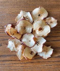 peeled apple slices on a wooden table