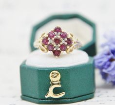 This ring is an absolute show shopper and made from 9ct Gold, Rubies & Diamonds. The ring has a stunning and very unusual checkerboard cluster design with a highly decorative mount.  Overall the design is stunning, a real show stopper. All stones are clear and bright and catch the light beautifully.   The ring is stamped with a full set of English hallmarks for 375 (9ct Gold) inside the band. Measurements: Ring size: UK M,  US 6 1/4. Gemstone panel: 1.5cm by 1.5cm. Weight: 3.1 grams. Heirloom Cluster Ring Gift, Heirloom Cluster Jewelry As Gift, Heirloom Cluster Jewelry For Gifts, Heirloom Cluster Jewelry Gift, Gold Cluster Ruby Ring As Gift, Ruby Cluster Jewelry Gift, Heirloom Ruby Cluster Ring As Gift, Heirloom Ruby Cluster Ring Gift, Cluster Ruby Ring With Diamond Accents For Gift