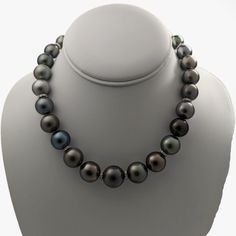 This necklace is absolutely stunning. Words can barely do it justice, but let me attempt to capture its essence. A magnificent treasure ready to be cherished for generations, this Tahitian pearl necklace represents the pinnacle of luxury and elegance. Expertly chosen pearls, arranged and artfully strung together to create a breathtaking masterpiece. Meticulously crafted, the necklace combines the rare glamour of Tahitian pearls with the rhodium-plated 14K yellow gold filigree ball clasp and tire Luxury Tahitian Pearl Necklace For Formal Occasions, Elegant Single Strand Tahitian Pearl Necklace, Luxury Single Strand Tahitian Pearl Necklace, Classic Tahitian Pearl Round Bead Necklaces, Classic Tahitian Pearl Round Bead Necklace, Formal Single Strand Tahitian Pearl Necklace, Classic Tahitian Pearl Beaded Necklace, Luxury Tahitian Pearl Single Strand Necklace, Elegant Tahitian Pearl Drop Necklace