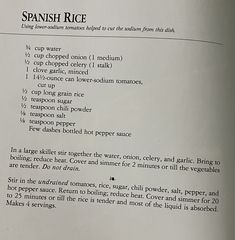 an open book with instructions on how to cook spanish rice