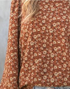 Details Rust Orange and Brown Color with Daisy Pattern Round Neck, Long Sleeve Romantic-Boho Style Made in USA Materials & Care 100% Polyester Machine Wash Cold Gentle, Lay Flat Orange Top, Rust Orange, Daisy Pattern, Shop Blouses, Floral Blouse, Fall Floral, Ethical Fashion, Rust, Round Neck