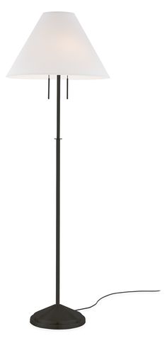 a floor lamp with a white shade on it's base and a cord plugged in