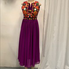 100% Authentic Mexican Shirt This Shirt Is Gorgeous. Color:Purple Size:S Materila"Manta Please Check Measurements To Make Sure Is The Size You Need. Chest: 20” Waist: 15.5” Sholder:12” Sholder To Hem:50.5” This Dress Can Fit Up To Medium Ebroidery Mexican Dress Folk Fabric Flowers Mexican Tunic Traditional Embroidery This Shirt Is Perfect For Any Occasion This Shirt Is Meant To Provide Extreme Comfort Throughout The Day The Perfect Gift For Her Multicolor Sleeveless Dress With Resham Embroidery, Purple Embroidered Dress For Summer, Purple Maxi Dress With Resham Embroidery, Festive Embroidered Purple Dress, Festive Bohemian Purple Dress, Purple Embroidered Bohemian Dress, Spring Purple Embroidered Dress With Floral Detail, Spring Purple Embroidered Dress, Fitted Purple Dress With Resham Embroidery